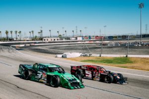 Matt perry (5) races to the inside of austin stewart (3) at irwindale speedway in the k&n filters 60 presented by traffic management inc. On july 18, 2020.