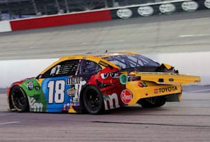 Kyle Busch brings his wrecked racecar onto pit road and prepares to turn into the garage, a move that resulted in a $50,000 fine from NASCAR.
