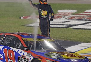 Martin Truex Jr. takes the checkered flag to advance to Round 2 in the NASCAR Cup Series Playoffs. Photo by Alan Marler/Harold Hinson Photography