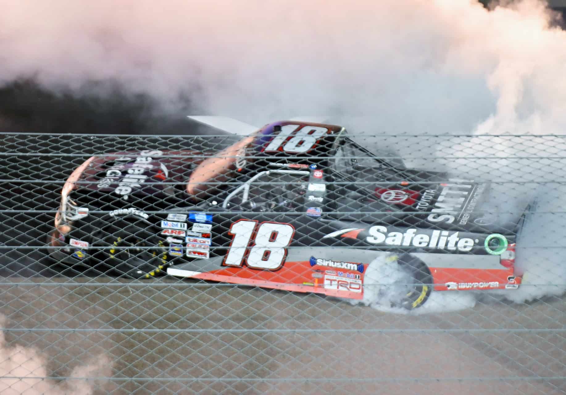 Chandler smith burns down the tries after winning the truck series race at phoenix raceway. Photo by jerry jordan/kickin' the tires