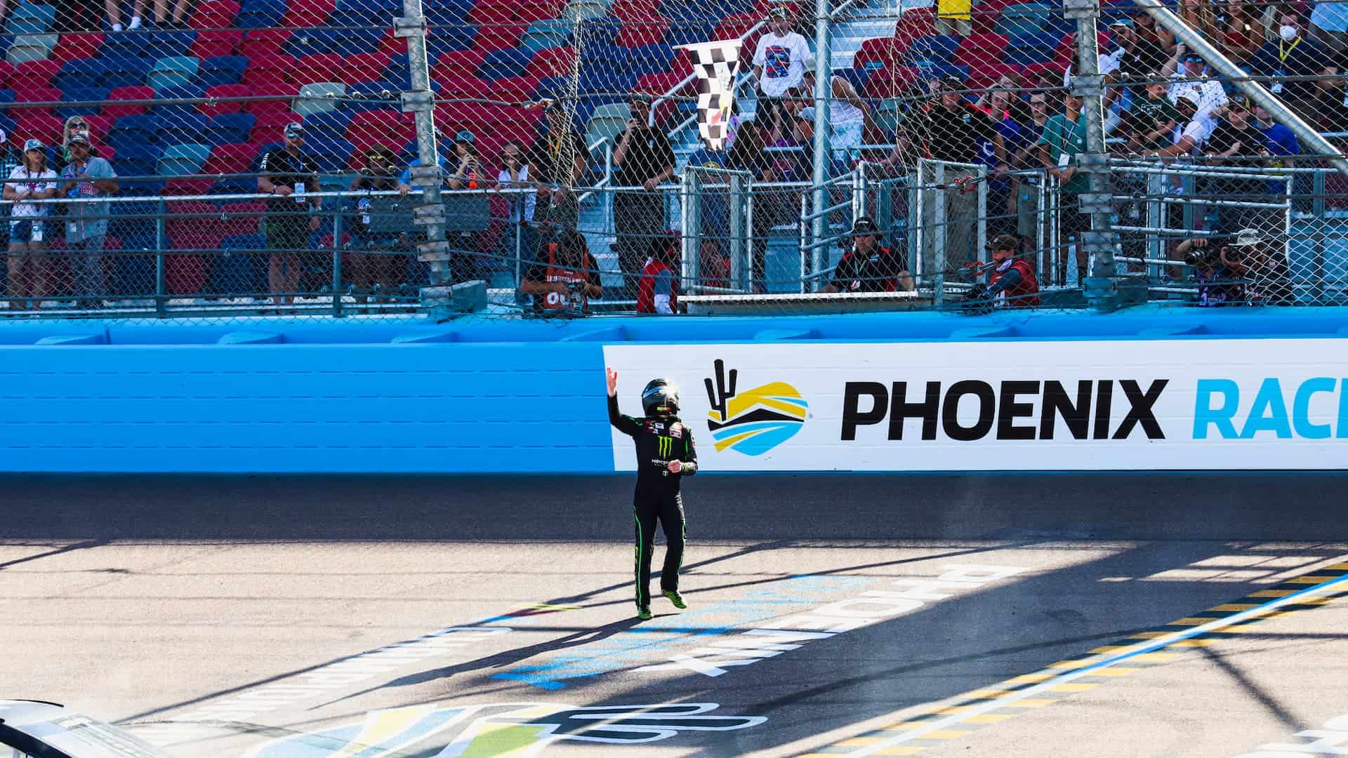 Ty Gibbs grabs the checkered flag after winning the 2021 Arizona Lottery 100 at Phoenix Raceway in the ARCA Menards Series West. Photo by Rachel Schuoler / Kickin' the Tires