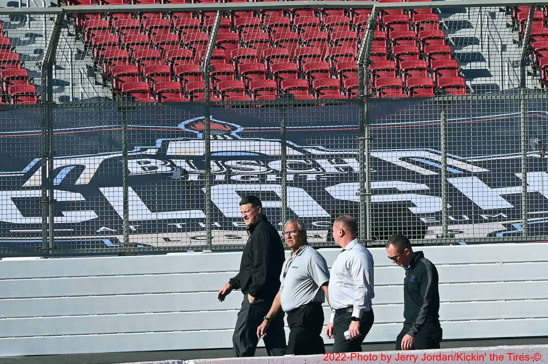 A group of nascar's racing competition team, including steve o'donnell, nascar executive vice president and chief racing development officer, walk the track inside the los angeles memorial coliseum. Photo by jerry jordan/kickin' the tires