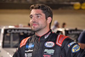 Jesse Little stands on the grid Thursday night at Bristol Motor Speedway.