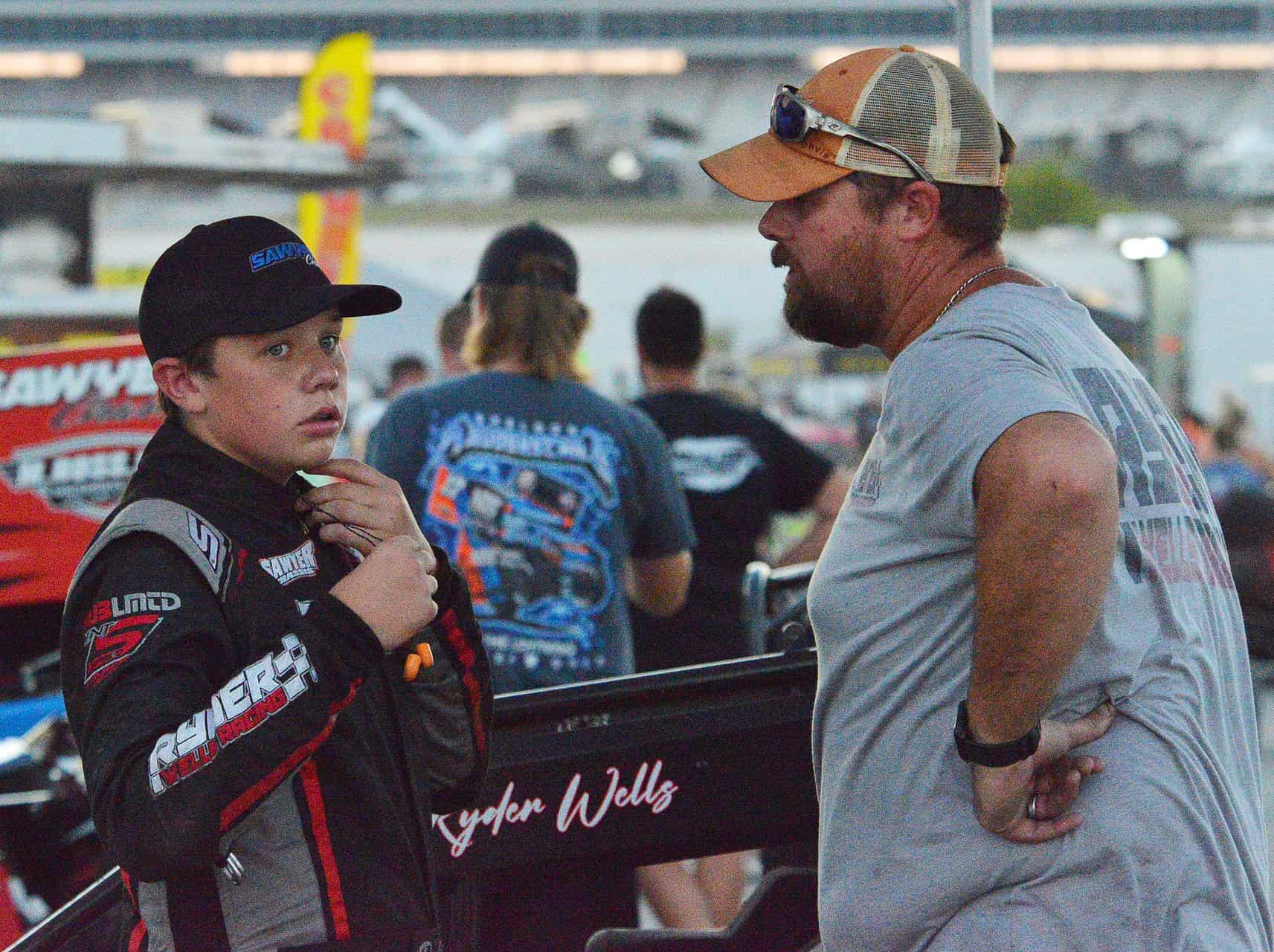 Ryder wells talks with his dad/crew chief about how his car handled during the race. Photo by jerry jordan/kickin' the tires