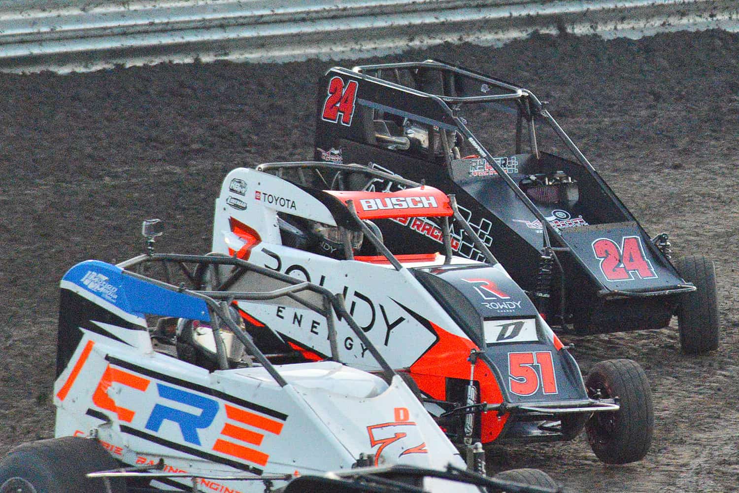 Ryder Wells drives the No. 24 Kickin' the Tires Outlaw Micro Sprint into Turn 1 just behind Kyle Busch and Dylan Schaadt during the C. Bell Micro Mania at Lil' Texas Motor Speedway but next week the action will be indoors for the 38th Tulsa Shootout. Photo by Jerry Jordan/Kickin' the Tires