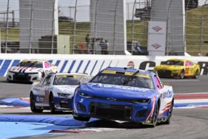 Kyle Larson stuck with nowhere to run being five laps down after late-race damage. Photo by Nigel Kinrade Photography.