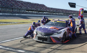Denny hamlin pits for tires and fuel at talladega superspeedway.