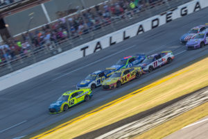 Ryan Blaney (12) leads a charging Chase Elliott (9) late in the YellaWood 500 at Talladega Superspeedway.