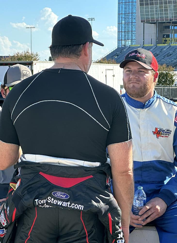 Tony stewart talks with some of the participants and drivers in the smoke show fantasy racing camp during a break at texas motor speedway. Photo by jerry jordan/kickin' the tires