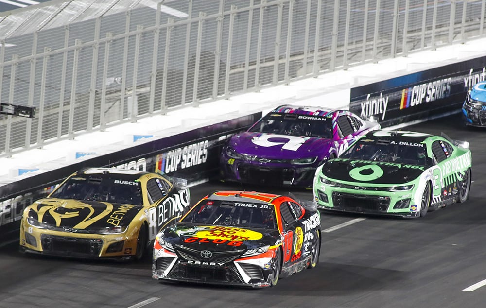 Martin Truex Jr. leads Kyle Busch and Austin Dillon late in the race he goes on to take the checkered flag in the NASCAR Clash. Photo by Ben Earp/NKP