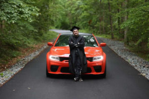 Stephen Mallozzi with his 2020 Dodge Charger, his university graduation photos. He has since sold the car so that he can have enough money to do the truck race at Gateway