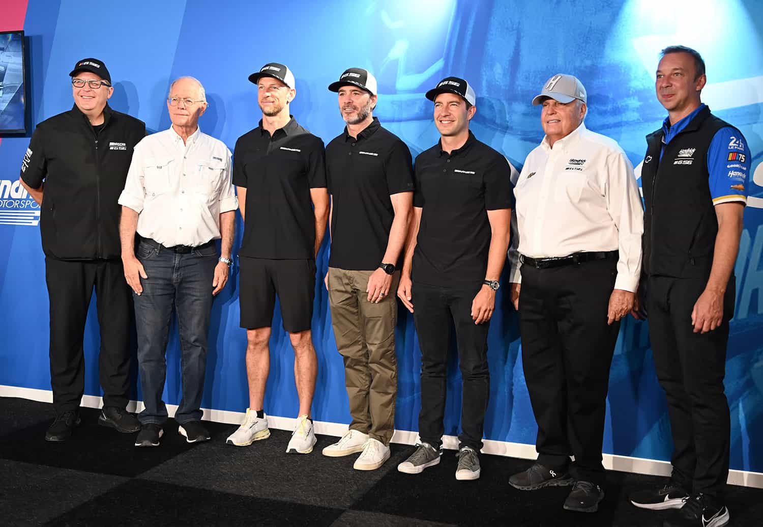 NASCAR CEO Jim France (white shirt, left) stands with Team Garage 56. Photo by Jerry Jordan/Kickin' the Tires.
