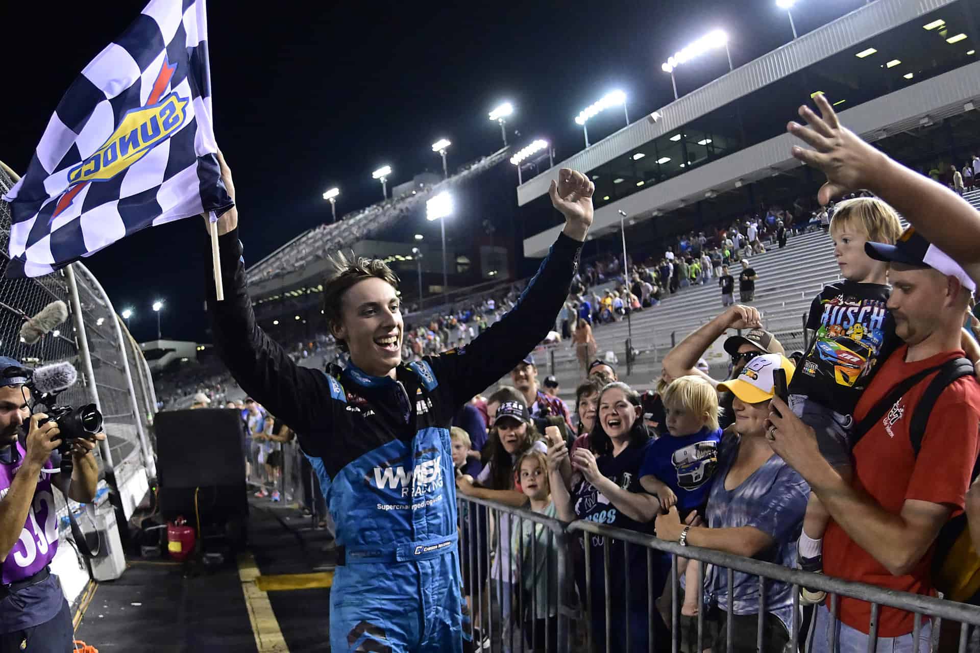Carson Hocevar took over the flag stand at Richmond Raceway to celebrate his NASCAR Craftsman Truck Series victory with the fans.