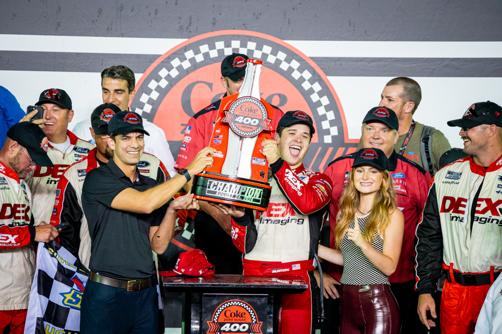 Harrison burton will forever remember this moment as he hoisted the daytona trophy in the air after his first-ever nascar cup series win. Photo by blake ulino/kickin' the tires